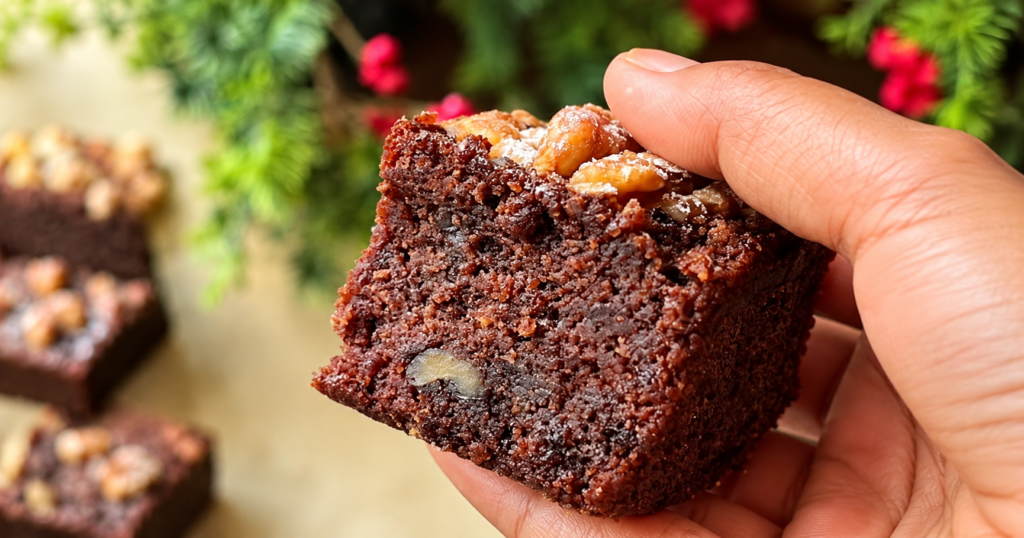 Fudgy gluten-free vegan brownie with walnuts and a moist chocolate crumb.