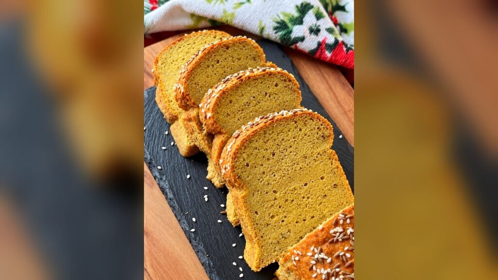 Sliced red lentil bread showing its golden, compact crumb