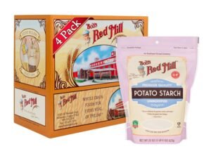 Four-pack of Bob's Red Mill whole grain potato starch in resealable pink bag, with an orange box of Bob's Red Mill products featuring a stone miller illustration in the background