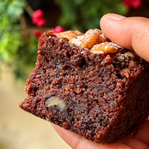 Fudgy gluten-free vegan brownie with walnuts and a moist chocolate crumb.